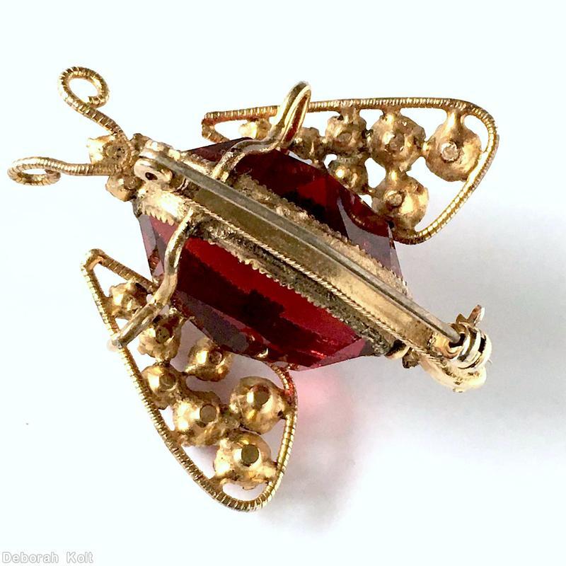Schreiner 2 wired wing large oval stone body bug 6 small chaton on wave decorated back bar 3 eye 7 varied size chaton in wing curly antenna ruby large faceted oval stone pink small chaton marbled coral small chaton jet small chaton goldtone jewelry