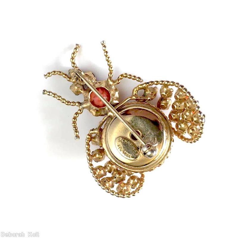 Schreiner abstract bug large round cab body 4 leg paired 2 antenna wired small stone wing jet small square stone eye coral matrix marbled pink round cab coral topaz goldtone jewelry