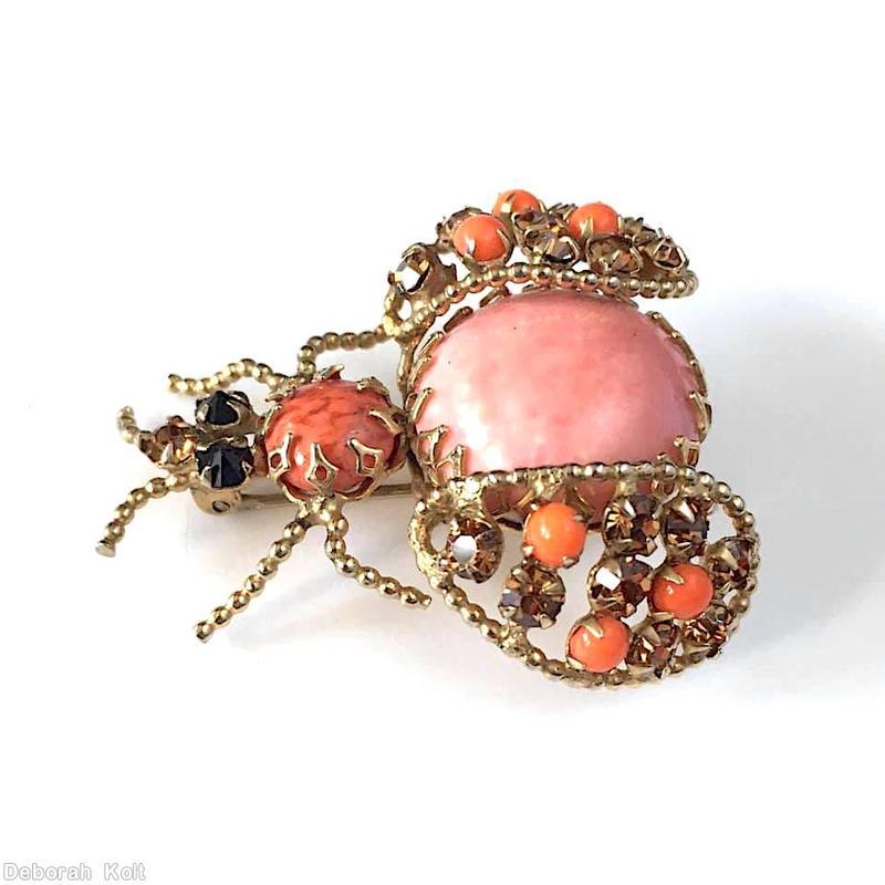 Schreiner abstract bug large round cab body 4 leg paired 2 antenna wired small stone wing jet small square stone eye coral matrix marbled pink round cab coral topaz goldtone jewelry