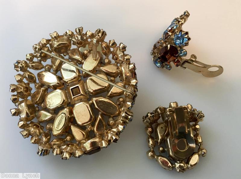 Schreiner hexagonal domed radial concave flat top pin small chaton center 6 surrounding navette 6 round stone on side wall ice blue amber jewelry