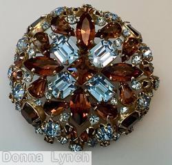 Schreiner hexagonal domed radial concave flat top pin small chaton center 6 surrounding navette 6 round stone on side wall ice blue amber jewelry