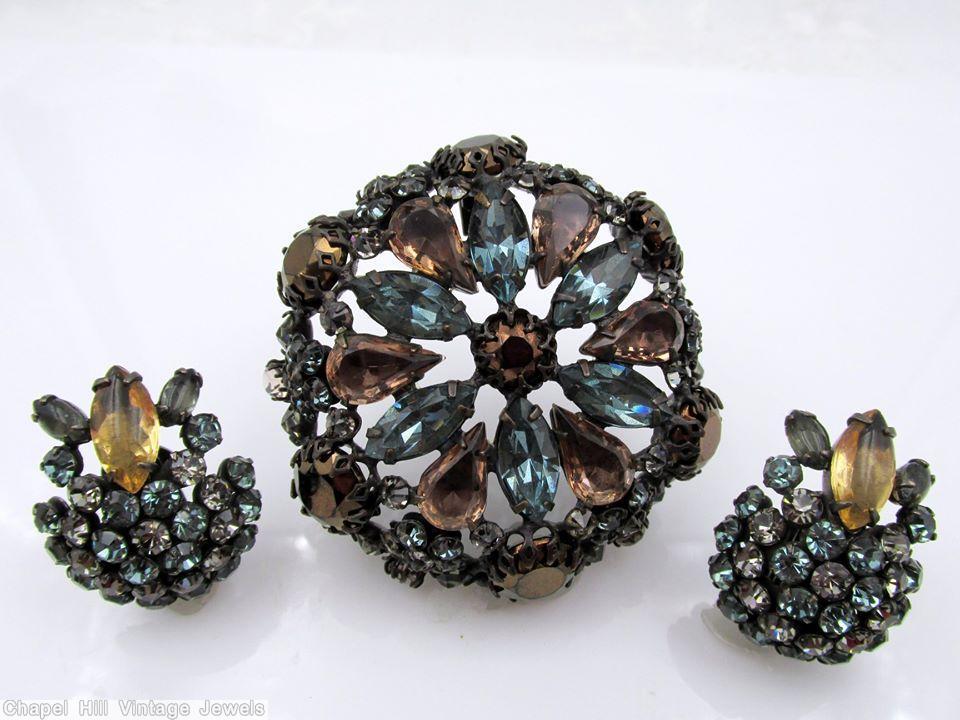 Schreiner hexagonal domed radial concave flat top pin small chaton center 6 surrounding navette 6 round stone on side wall smoky blue smoky topaz metalic brown crystal pale green jewelry
