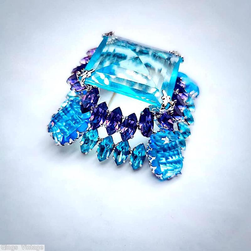 Schreiner high domed large faceted square center square pin 4 large emerald cut at corner 2 round small navette side clear aqua large faceted square open back stone purple clear aqua emerald cut silvertone jewelry