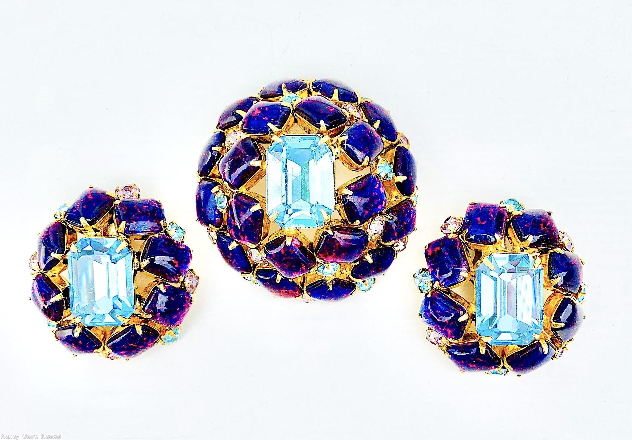 Schreiner high domed oval 20 emeçrald cut stone pin large emerald cut center 8 surrounding stone 12 second round stone small chaton ice blue pink fluss lapis goldtone jewelry