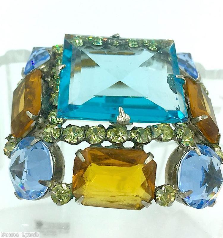Schreiner large square center domed square pin 4 pointy corner stone 4 emerald cut side large faceted square stone topaz emerald cut pale blue large inverted stone silvertone jewelry