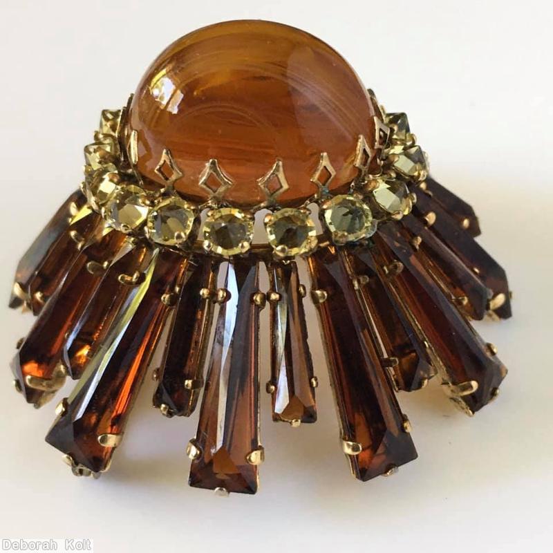 Schreiner oval high domed keystone ruffle pin large oval center varied length keystone root beer keystone champagne inverted surrounding stone marbled amber large oval cab center goldtone jewelry