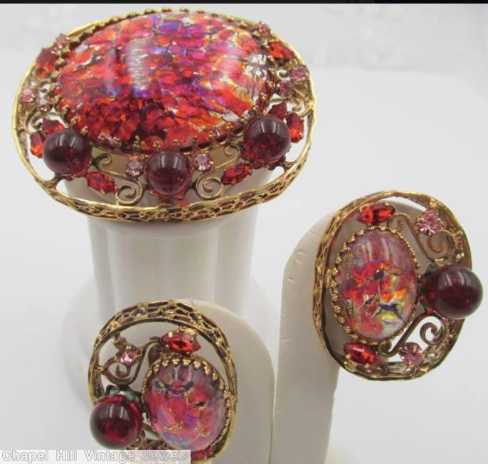 Schreiner oval shadow box pin 1 large oval stone 3 round cab 4 scrollwork speckled ruby ruby pink goldtone jewelry