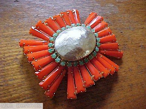 Schreiner radial keystone ruffle cross pin large oval center hook eye coral keystone large oval metalic faux pearl 1 round surrounding green small chaton jewelry