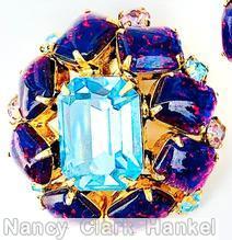 Schreiner 8 rectangle stone surrounding large emerald cut center 8 small chaton pink speckled purple ice blue emerald cut crystal goldtone jewelry