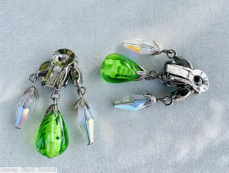 Schreiner top down dangling earring 1 large dangling teardrop in the middle 2 large diamond shaped dangling bead top 3 navette 2 small chaton clear green molded large teardrop faceted diamond shaped crystal bead small ab chaton green navette ab large navette silvertone jewelry