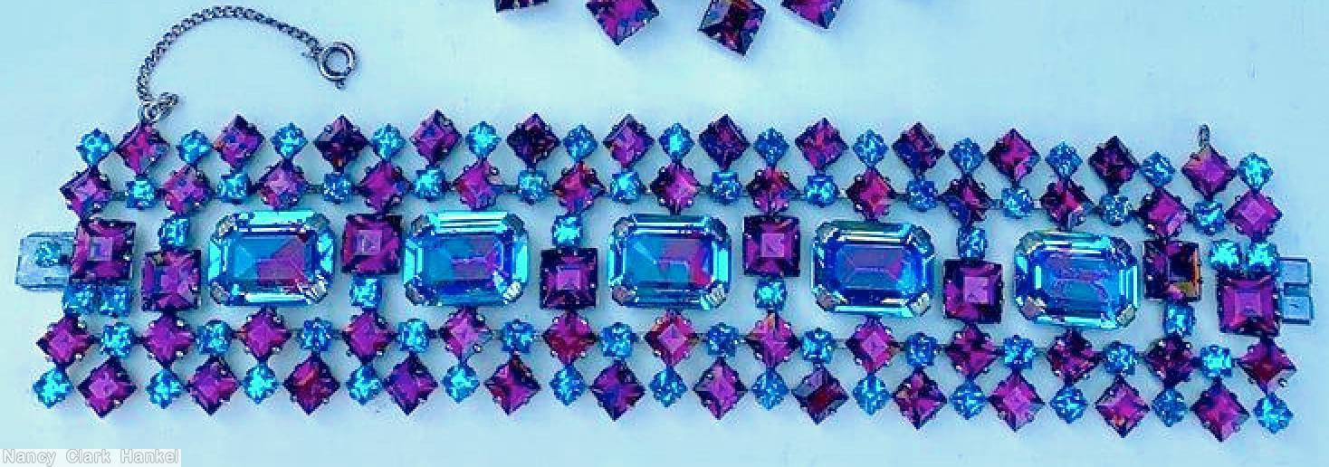 Schreiner 5 row wide bracelet 5 large emerald cut in center 12 square stone 13 small chaton border row 13 square stone 12 small chaton inner row bicolor ruby clear aqua large emerald cut purple square stone clear aqua stone jewelry