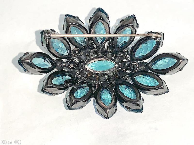 Schreiner 12 navette side domed oval pin 12 small baguette surrounding oval center smoky blue large faceted oval stone brown metalic faceted baguette large oval faceted aqua center gunmetal jewelry
