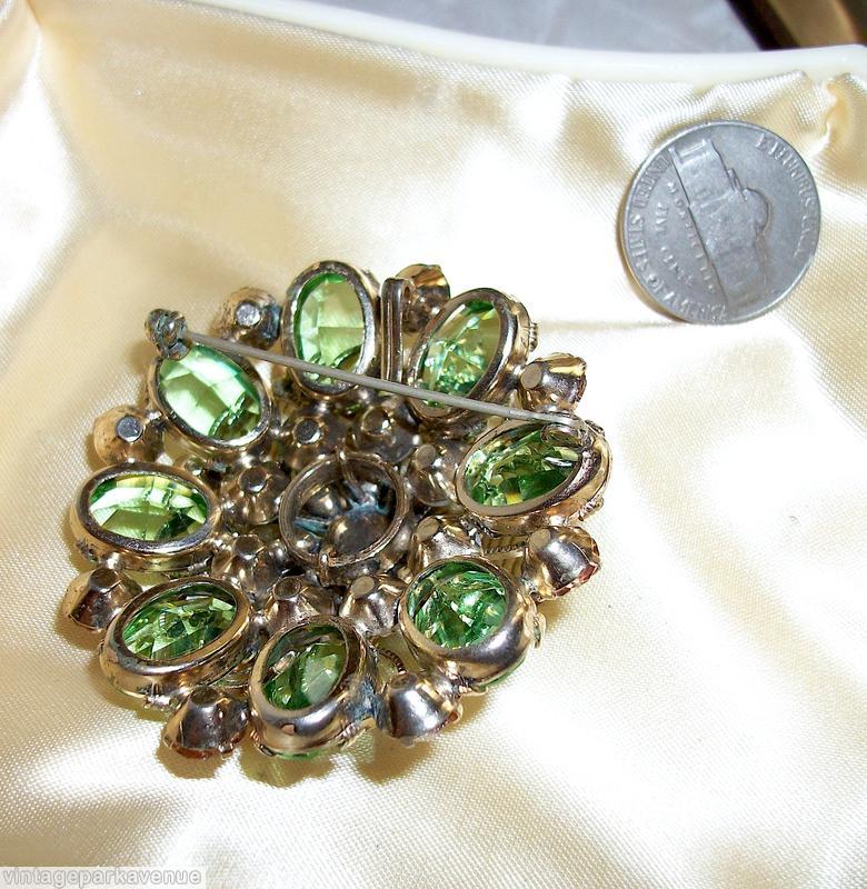 Schreiner 2 level 8 scrollwork radial pin large round chaton center 8 surrounding navette bottom 8 large oval stone 8 large round cab celery green large faceted oval stone jade navette fuschia large inverted round center peach inverted large stone moonglow white round cab goldtone jewelry