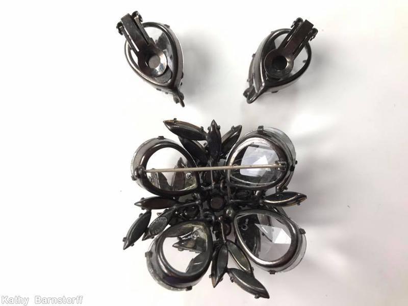 Schreiner 2 level domed square pin 4 large teardrop corner stone 9 inverted center stone random arranged navette surrounding brown crystal jewelry