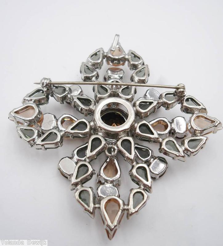 Schreiner 2 level radial cross pin large round stone center bottom level 8 surrounding small teardrop top level 8 surrounding small teardrop smoke peach metalic brown jewelry