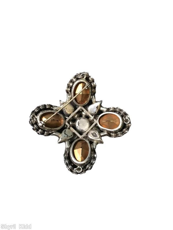 Schreiner 2 level radial maltese pin bottom 4 large oval 4 half acorn cluster 4 teardrop top round center 7 teardrop surrounding ruby navy bicolor faceted round center stone pale pink teardrop large ab teardrop purple large oval faceted oval stone ab chaton fuschia chaton crystal chaton jewelry