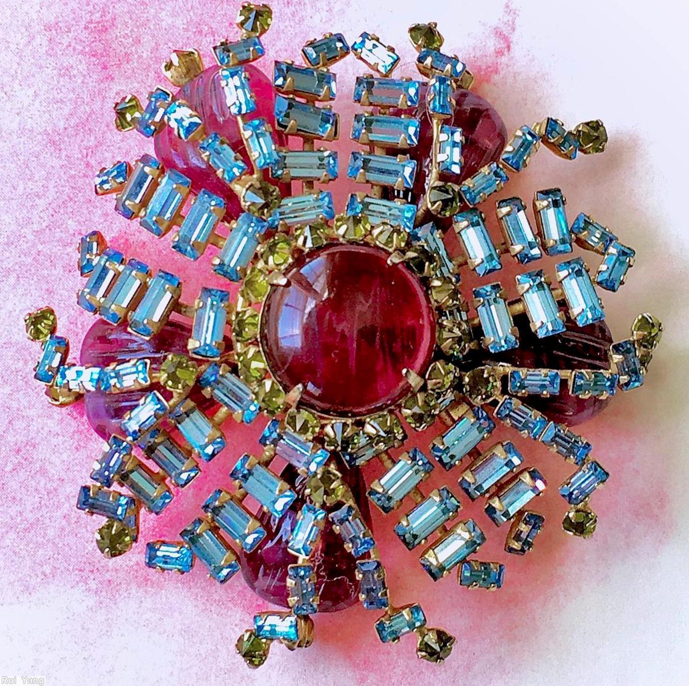 Schreiner 2 level radial pin large round cab center 16 small surrounding stone 20 branch of bagette bottom 5 teardrop marbled raspberry round cab center ice blue small baguette peridot small inverted stone raspberry teardrop art glass goldtone jewelry