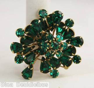 Schreiner 2 level radial pin top level small chaton center 6 surrounding small oval stone bottom level 6 long branch of single teardrop 6 branch of 3 stone emerald jewelry