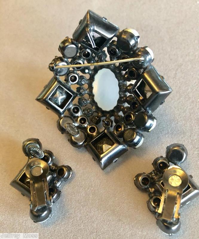 Schreiner 4 large square stone corner domed radial diamond shaped pin large oval center 3 rounds metalic silver faceted square corner stone frosted opaque white large oval center faux pearl metalic brown jewelry