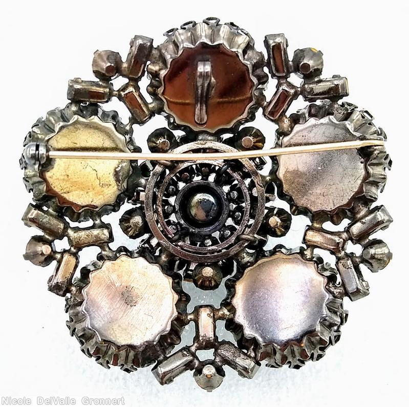 Schreiner 5 round cab radial pin round cab center 11 surrounding small chaton 15 small baguette green large round cab ruby center round cab crystal small chaton green small baguette jewelry