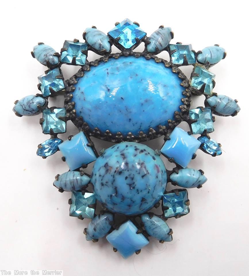 Schreiner bilateral symmetrical pin large oval stone center large round cab bottom surrounding mix of small square stone navette turquoise clear aqua opaque aqua silvertone jewelry