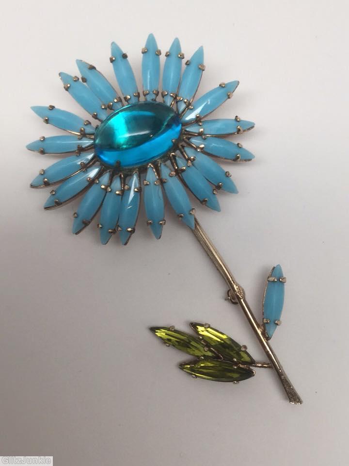 Schreiner black eye daisy pin long stem large oval center 20 petal 4 leaf baby blue navette peridot leaf navette clear aqua large oval cab jewelry