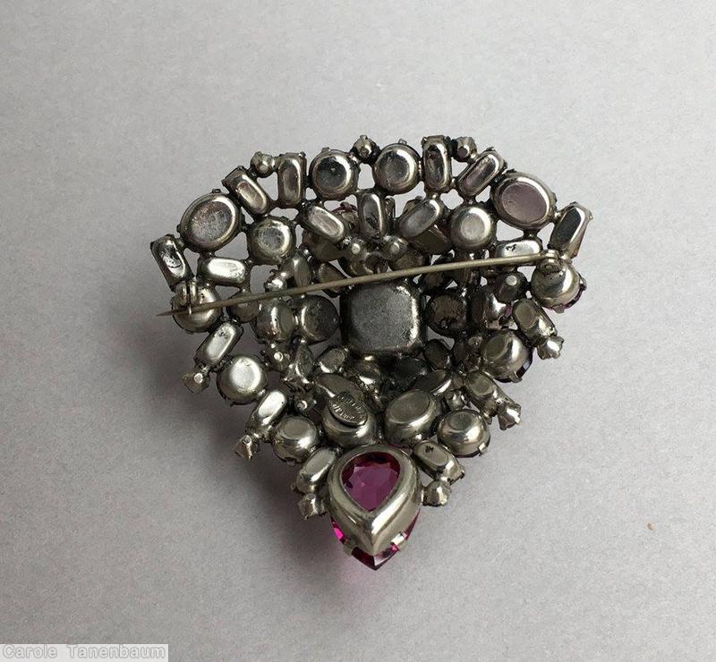 Schreiner domed triangle shaped pin large square stone center 1 large teardrop small baguette 4 surrounding small baguette 2 surrounding oval stone 4 surrounding chaton fuchsia pink purple ice blue jewelry