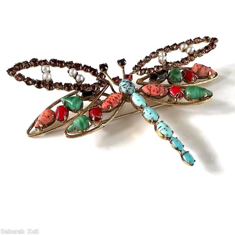 Schreiner dragonfly pin 6 varied size oval cab body 2 level wings top level 2 arched with inverted stone bottom 4 wired wing large wing 2 teardrop one oval cab one navette small wing 1 teardrop 1 oval cab 1 navette turquoise navette body matrix coral navette marbled jade teardrop small oval carnelian topaz small chaton fuschia small chaton jet small chaton faux pearl goldtone jewelry