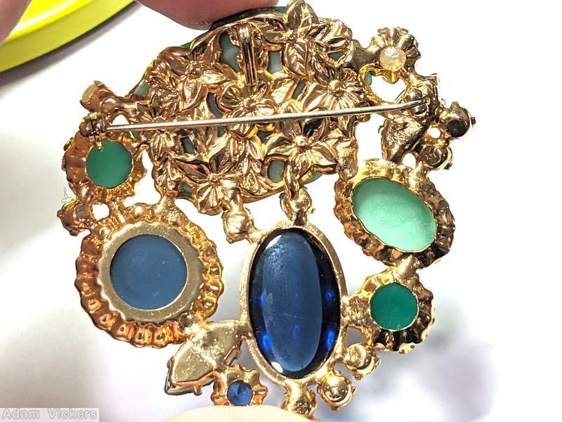 Schreiner end of day with large moon rock randome arranged mix of large oval cab large round cab navette chaton large jade moon rock navy large oval cab navy large round cab marbled jade large navette faux pearl crystal small chaton goldtone jewelry