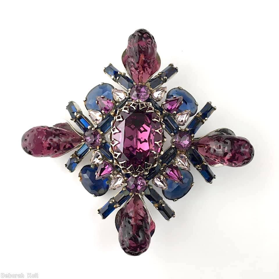Schreiner fancy cross radial pin 2 by 2 baguette row 4 large art glass large oval cab center 4 oval cab 12 small teardrop lavender art glass purpla large oval center peach navy oval cab navy small baguette silvertone jewelry