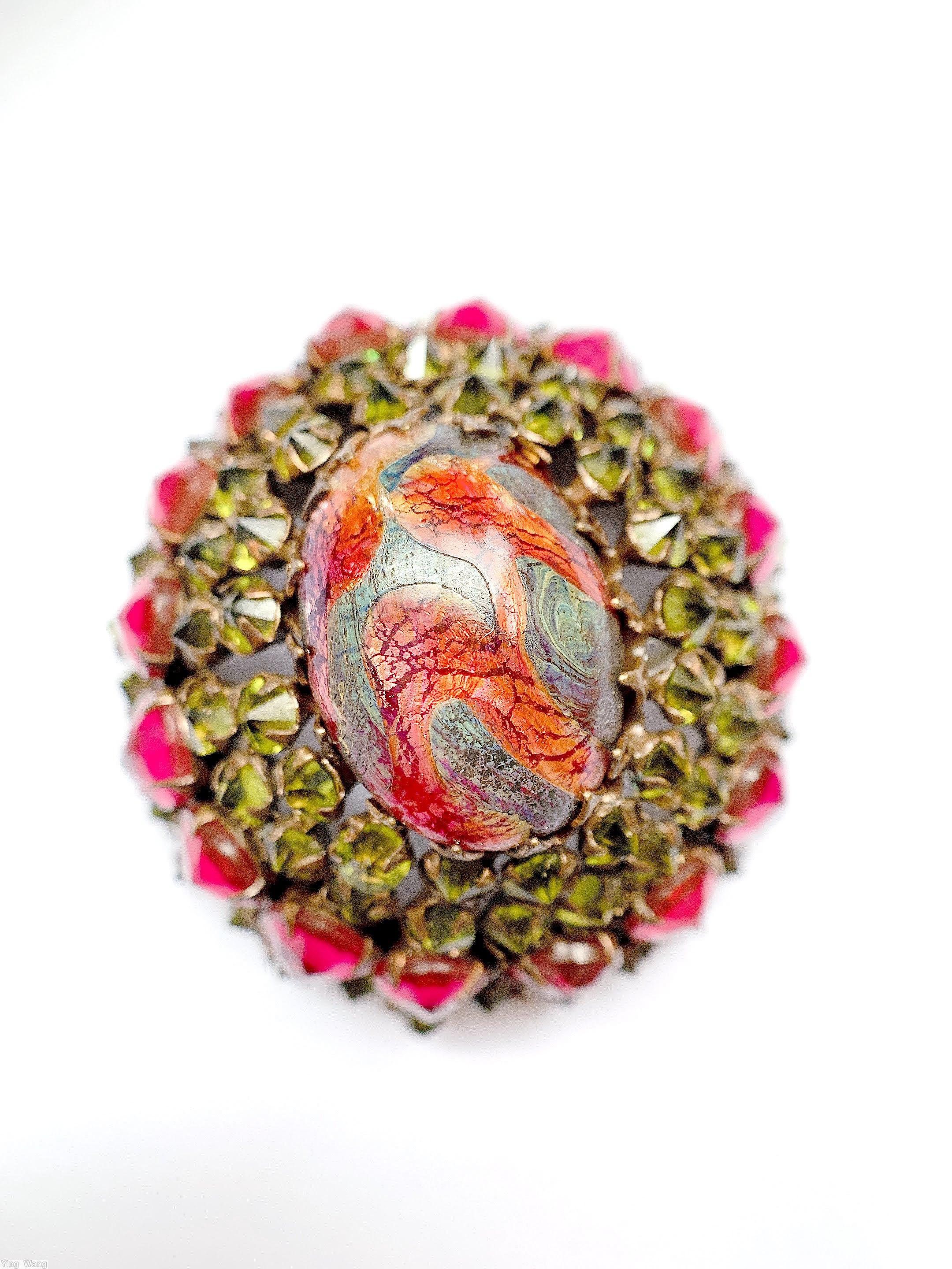 Schreiner high domed oval pin 4 round large oval center stone 16 large inverted side stone 17 surrounding inverted stone red gray marbled large oval center stone peridot inverted ruby large inverted goldtone jewelry