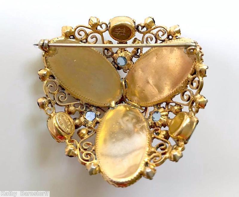 Schreiner high domed radial 3 large oval cab pin scrollwork 3 large chaton 21 small chaton carnelian oval flat top stone ice blue inverted goldtone jewelry