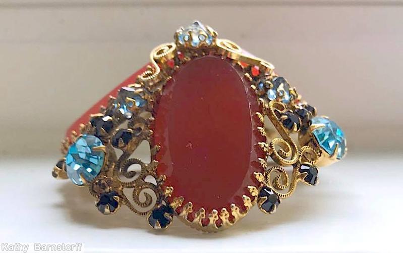 Schreiner high domed radial 3 large oval cab pin scrollwork 3 large chaton 21 small chaton carnelian oval flat top stone ice blue inverted goldtone jewelry