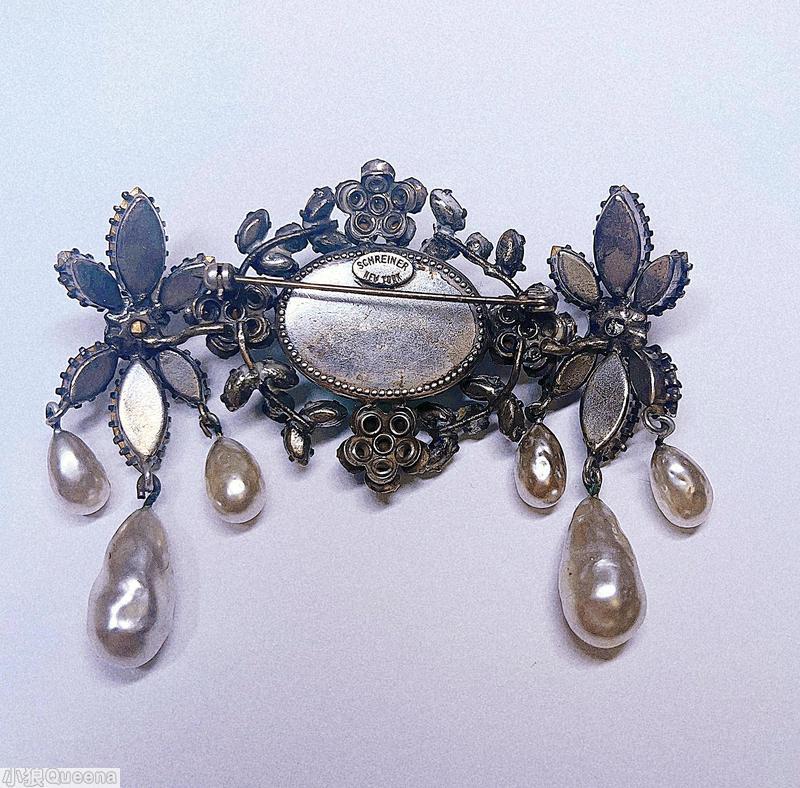 Schreiner horizontal 2 flower end large oval center pin 2 clustered flower 4 branch 3 dangling barroque pearl on each end crystal marbled emerald jewelry