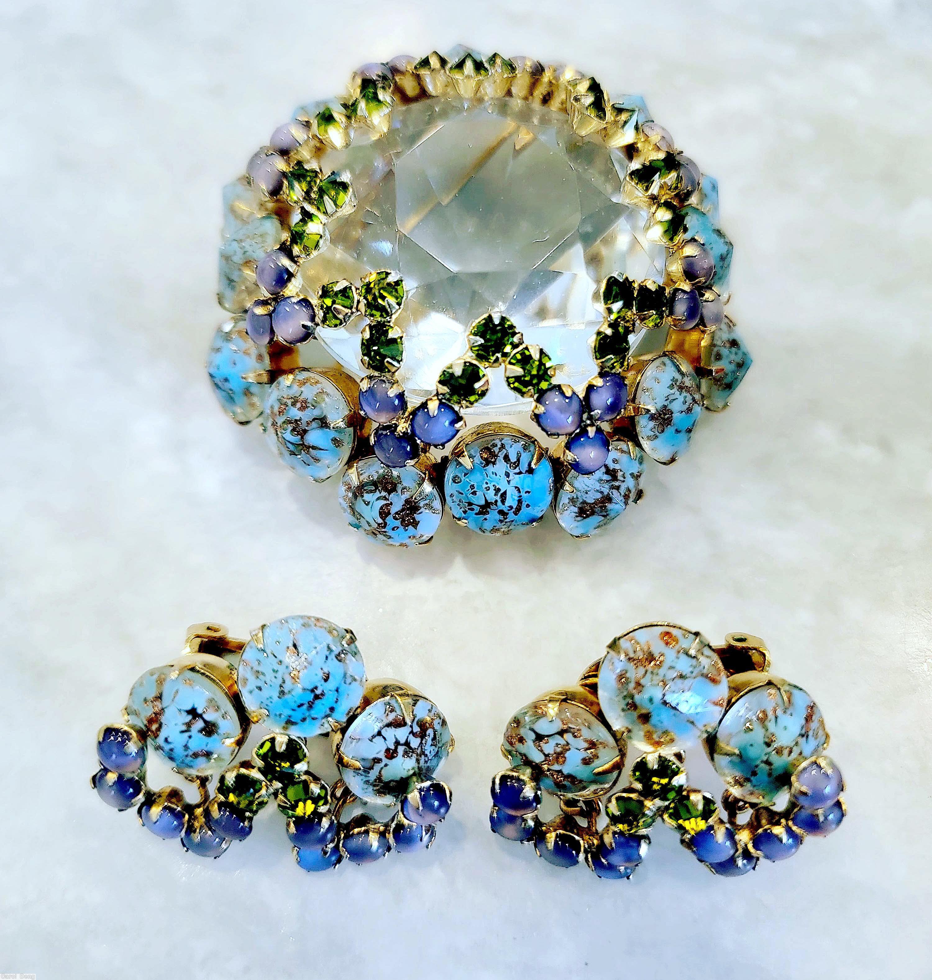 Schreiner large faceted open back center domed round pin 8 waves of seeds 16 oval stone side crystal aqua venetian chaton purple moonglow small chaton peridot small chaton goldtone jewelry