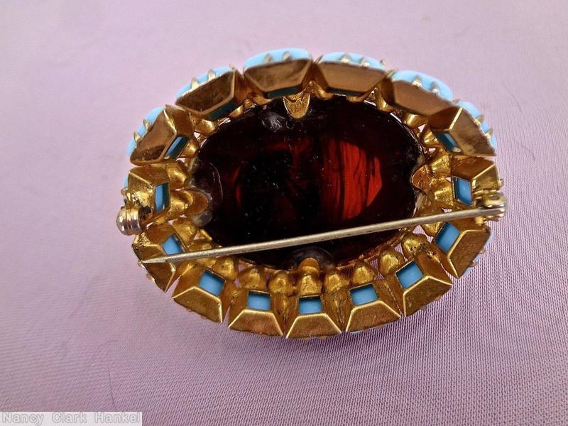 Schreiner large highly domed oval shaped jelly belly pin large half egg shaped jelly belly center 15 small square stone at side clear dark red jelly belly stone opaque baby blue square stone crystal goldtone jewelry