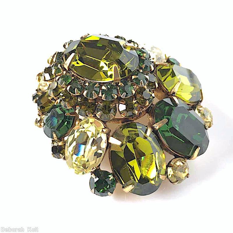 Schreiner large oval center teardrop shaped pin varied size oval cab inverted stone 2 rounds around center olivine large oval faceted center stone emerald clear champagne goldtone jewelry
