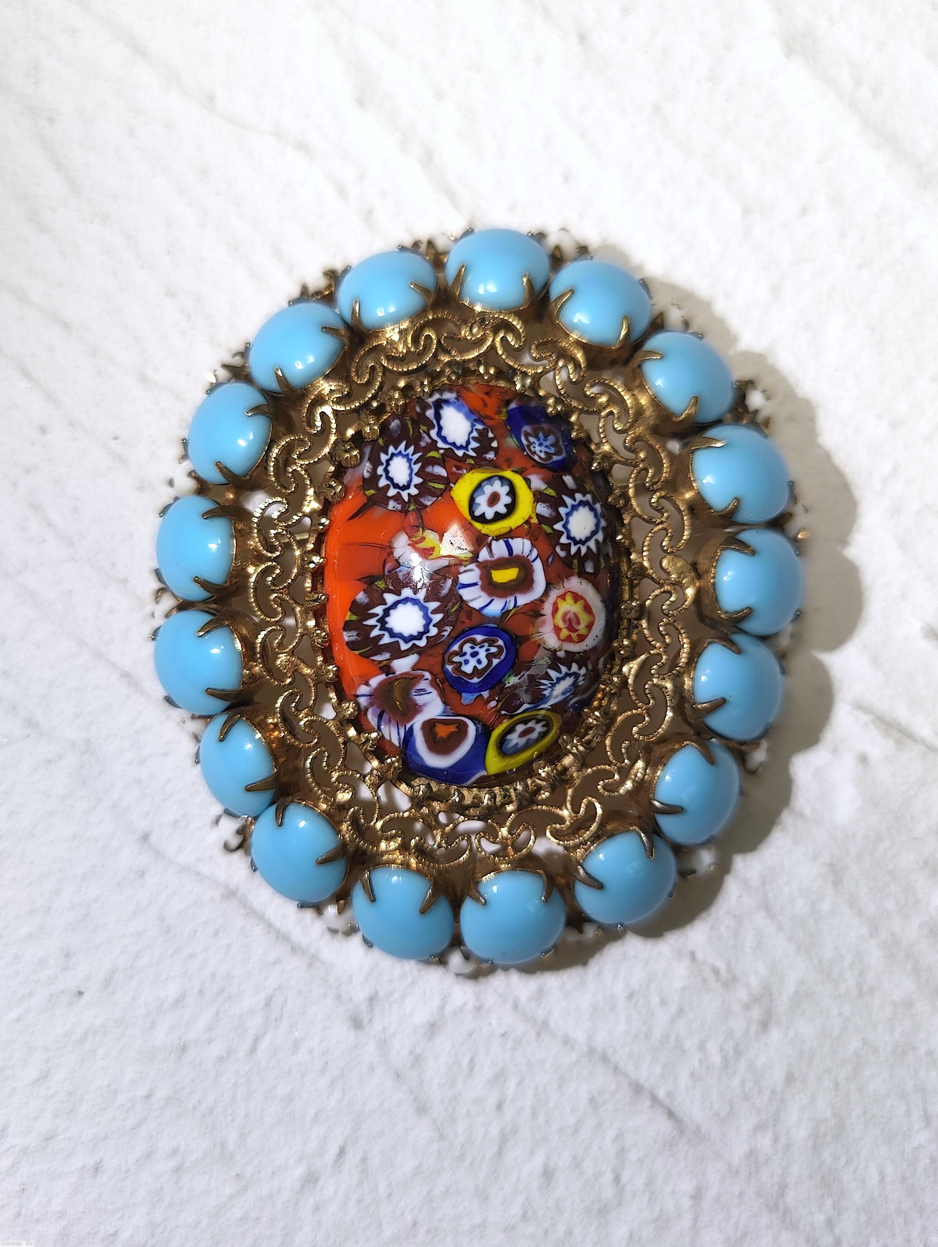 Schreiner large oval millefiori center domed oval pin filigree 17 oval cab side opaque baby blue white seeds goldtone jewelry