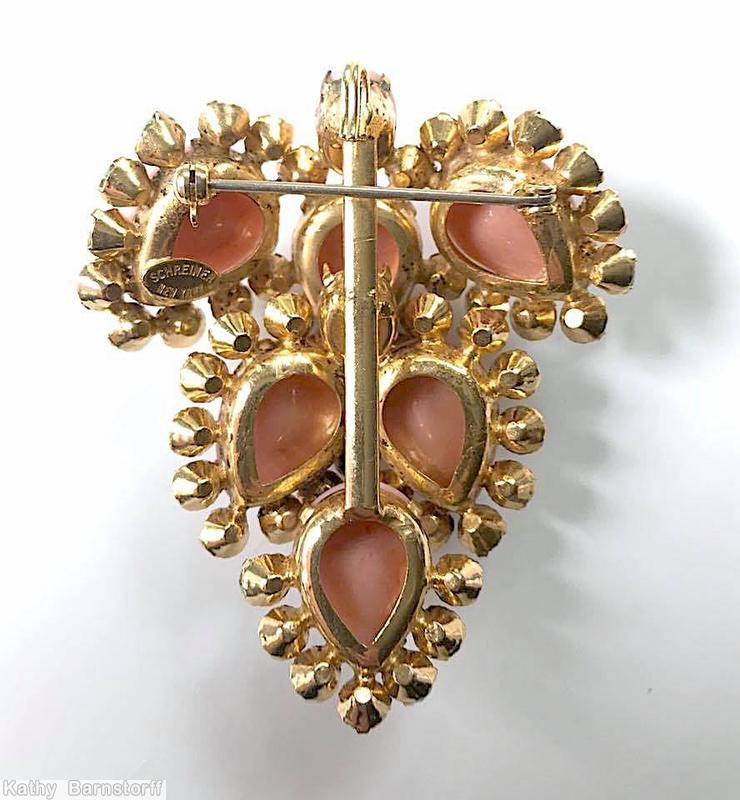 Schreiner leaf shaped 6 large teardrop pin bordered by small chaton 1 small round cab pink opaque large teardrop opaque apple green small chaton goldtone jewelry