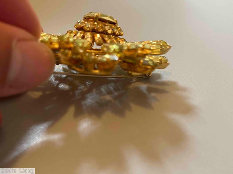Schreiner navette ruffle pin hook eye domed oval center 2 rounds surrounding stone clear champgne goldtone jewelry