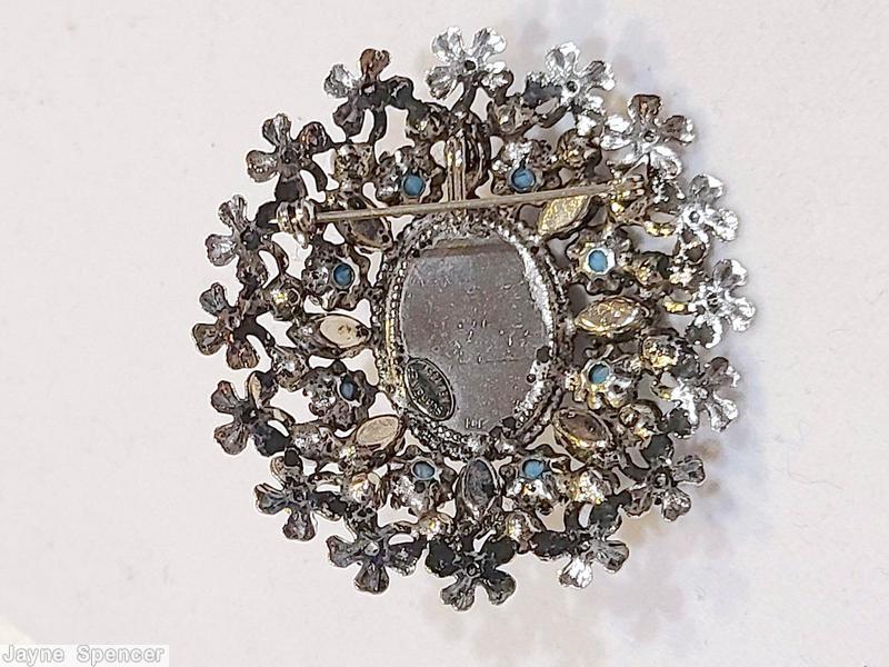 Schreiner oval 16 metal flower radial pin large oval cab center 8 surrounding small navette 8 small chaton large marbled purple oval cab center turquoise small round cab peridot inverted stone faux pearl silvertone jewelry