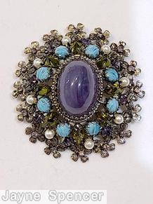 Schreiner oval 16 metal flower radial pin large oval cab center 8 surrounding small navette 8 small chaton large marbled purple oval cab center turquoise small round cab peridot inverted stone faux pearl silvertone jewelry