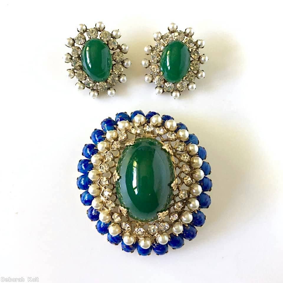 Schreiner oval domed radial pin large oval center 23 surrounding small chaton 3 rounds filigree lapis small oval cab faux pearl crystal small chaton goldtone jewelry