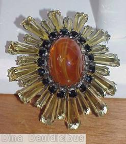Schreiner oval high domed keystone ruffle pin large oval center varied length keystone clear champagne keystone 1 round small square stone marbled amber large oval cab jewelry