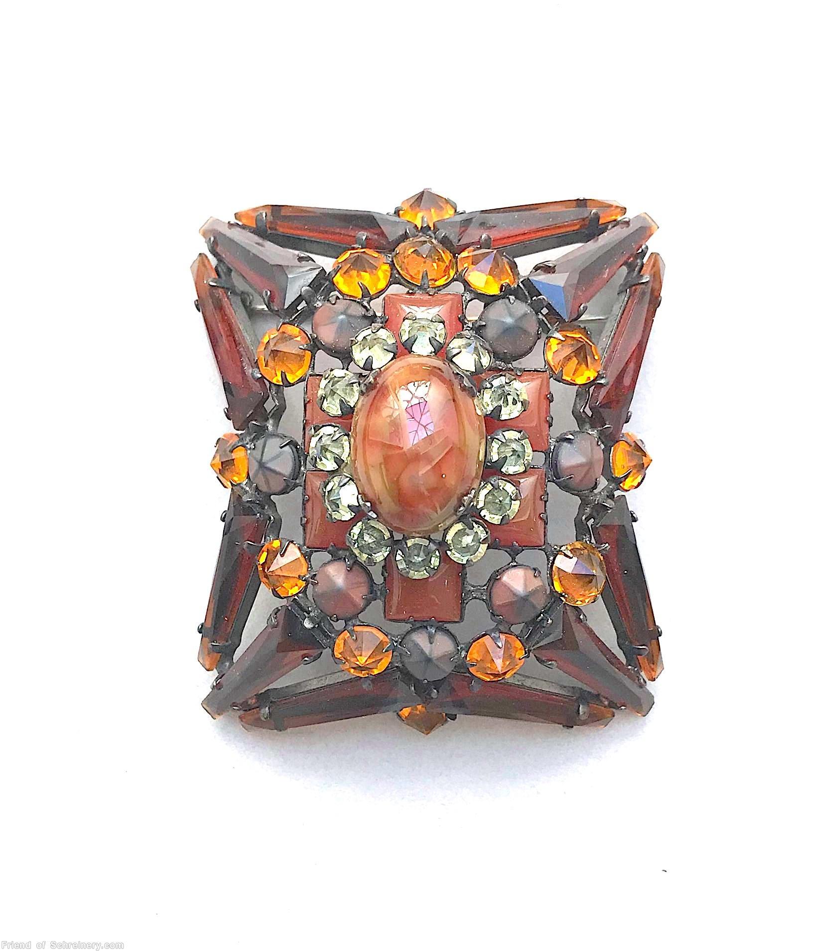 Schreiner rectangle radial domed 12 keystone pin oval cab center 6 square stone 12 surrounding chaton brown keystone carnelian square stone clear champgne inverted small surrounding stone amber matte brown inverted marbled coral oval cab center jewelry