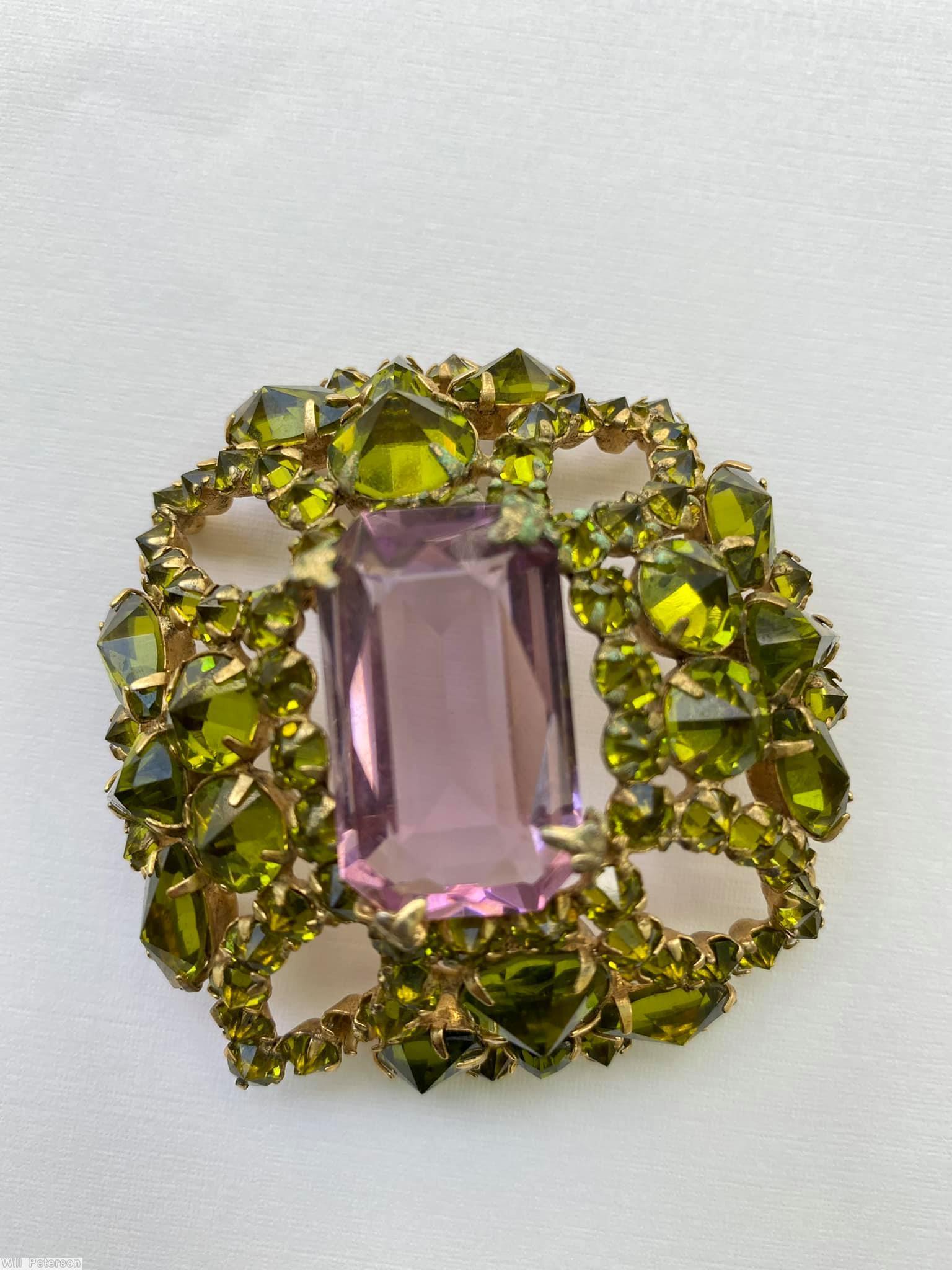 Schreiner rectangle shaped domed radial pin 4 small chaton formed circle at corner 5 large rectangle stone 12 surrounding navette large clear amethyst emerald cut center stone olivine inverted stone goldtone jewelry