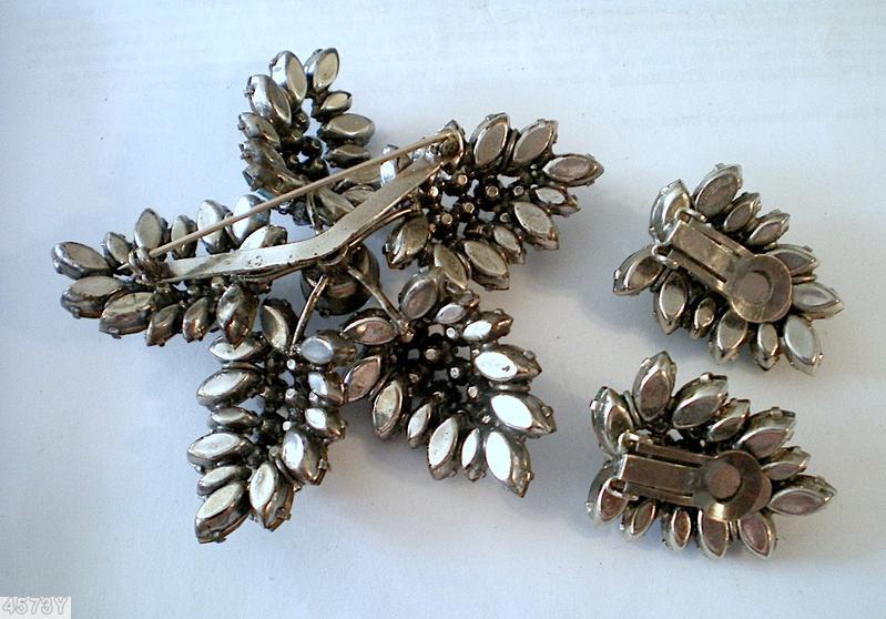 Schreiner star shaped radical pin round cab center 5 surrounding bush like branch on stem small navette small chaton royal blue round cab center ice blue navette peridot small chaton smoky navette silvertone jewelry