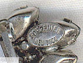 Schreiner star shaped radical pin round cab center 5 surrounding bush like branch on stem small navette small chaton royal blue round cab center ice blue navette peridot small chaton smoky navette silvertone jewelry