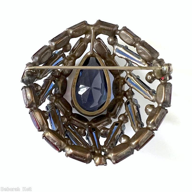 Schreiner swirled 9 keystone high domed oval pin 3 rounds large teardrop center slim rectangle cab bordered large faceted navy teardrop navy keystone ice blue small chaton ice pink small chaton bicolor royal blue raspberry rectangular stone jewelry