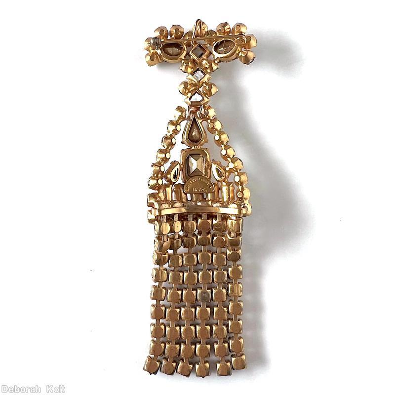 Schreiner top down long fringe pin top bar shape 2 large oval stone 12 surrounding small chaton middle triangle shape large teardrop large emerald cut center 5 baguette small chaton border 6 fringe of 9 chaton crystal goldtone jewelry